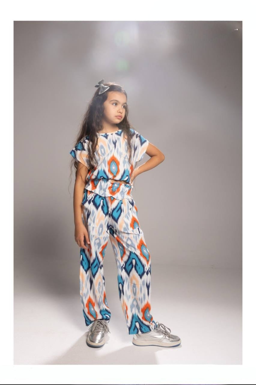 Girls’ Printed Wide-Leg Pants Set – Short-Sleeve Top & Relaxed Trousers with Colorful Geometric Pattern