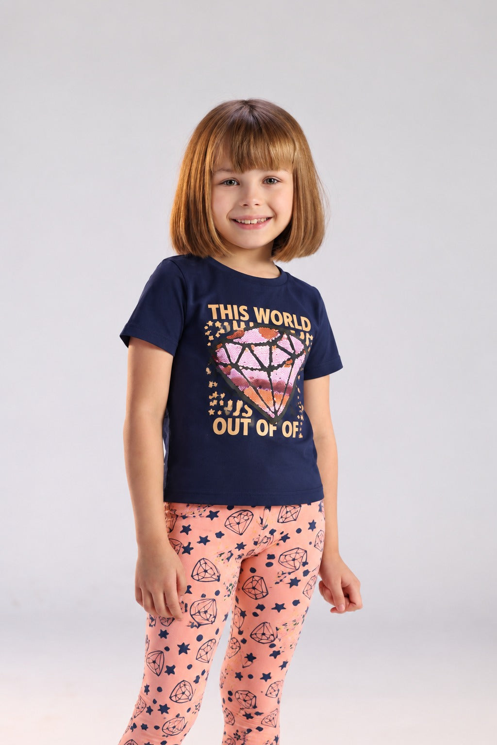 Girls’ 2-Piece Printed Outfit Set – Graphic T-Shirt & Patterned Capri Leggings