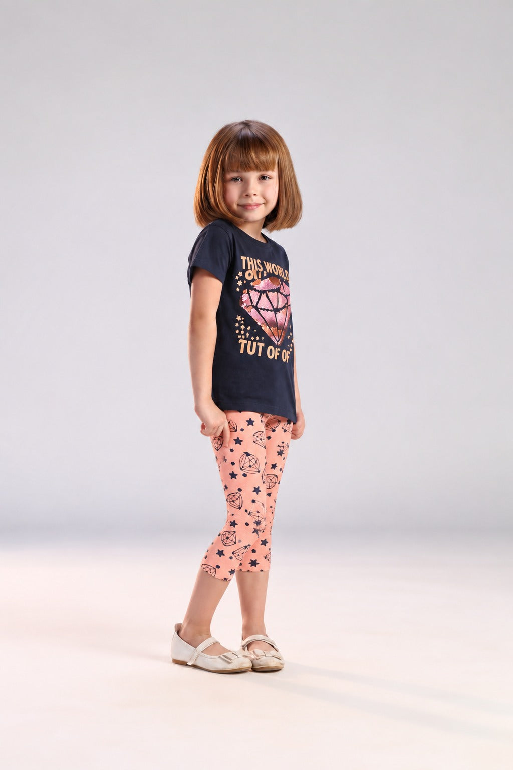 Girls’ 2-Piece Printed Outfit Set – Graphic T-Shirt & Patterned Capri Leggings